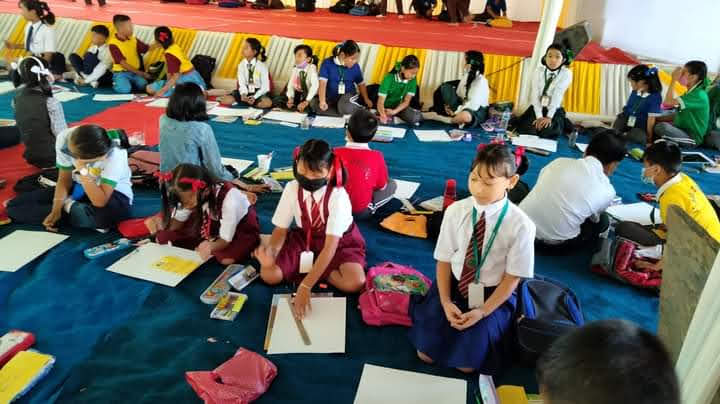 Students taking part on painting competition